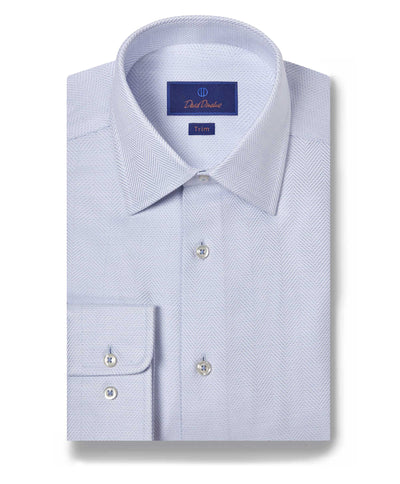 A neatly folded David Donahue TBSP10013 light blue Pima cotton dress shirt features a herringbone pattern, spread collar, buttoned cuffs, and a Trim label inside the collar.