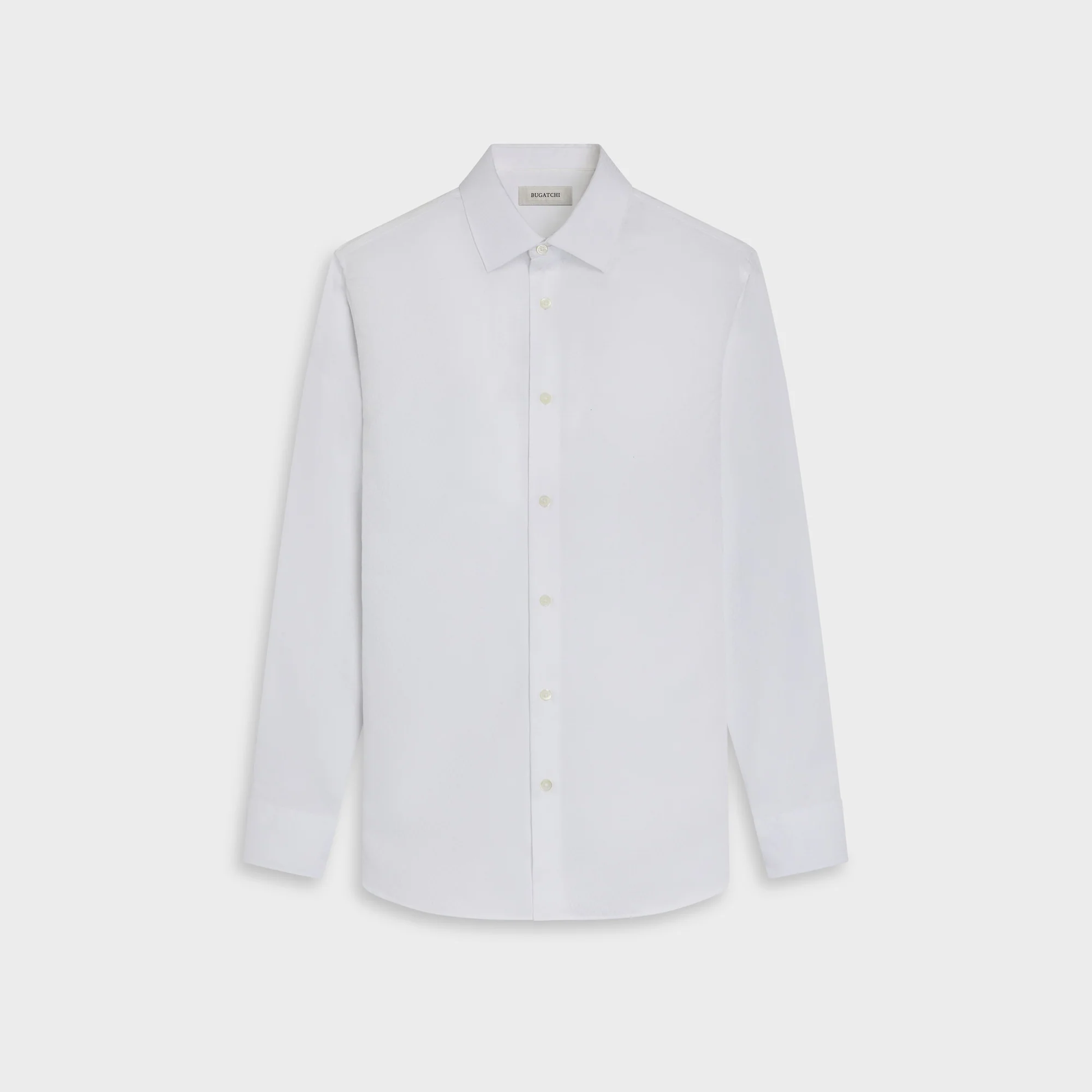 A crisp white Bugatchi Julian Tonal Geometric Jacquard Shirt (KS4001L3S) with long sleeves, a button-up front, and a classic collar is displayed on a flat, light background. This stylish wrinkle-resistant dress shirt from Bugatchi combines comfort and sophistication for any occasion.