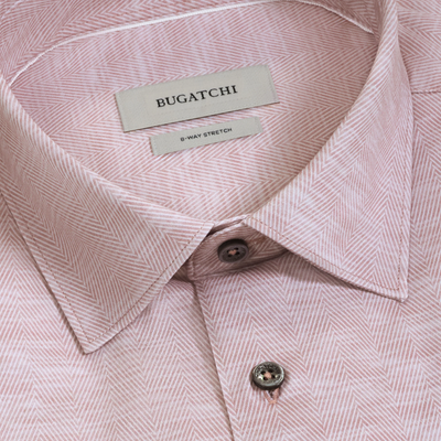 Close-up of the Bugatchi James Herringbone Sport Shirt KF9508K60 in pink, featuring a subtle herringbone pattern, detailed collar and buttons, and a brand label reading Bugatchi. This sport shirt combines sophisticated style with the comfort and flexibility of performance fabric.