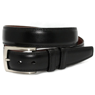 The Torino Belt Smooth by Torino, featuring black Italian leather and a silver buckle, is coiled neatly against a plain white background to showcase its classic style.