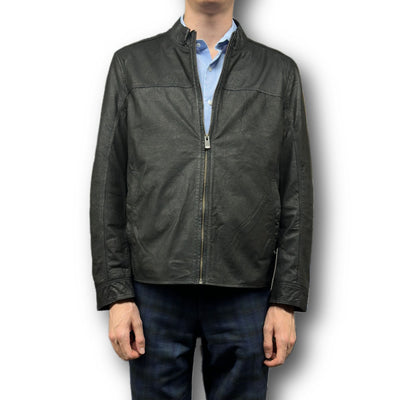 A person wearing the Missani Vintage Leather Jacket 392794 over a light blue collared shirt and dark pants, standing against a white background.