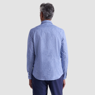 A man with gray hair is shown from the back, wearing a Bugatchi Julian Paisley Sport Shirt HS3069L3S and dark blue pants against a plain light background.