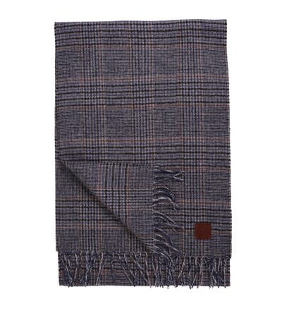 The Amanda Christensen Check Pattern Scarf 440700 features classic plaid wool, fringed ends, and a small brown leather patch—an elegant accessory from Amanda Christensen.