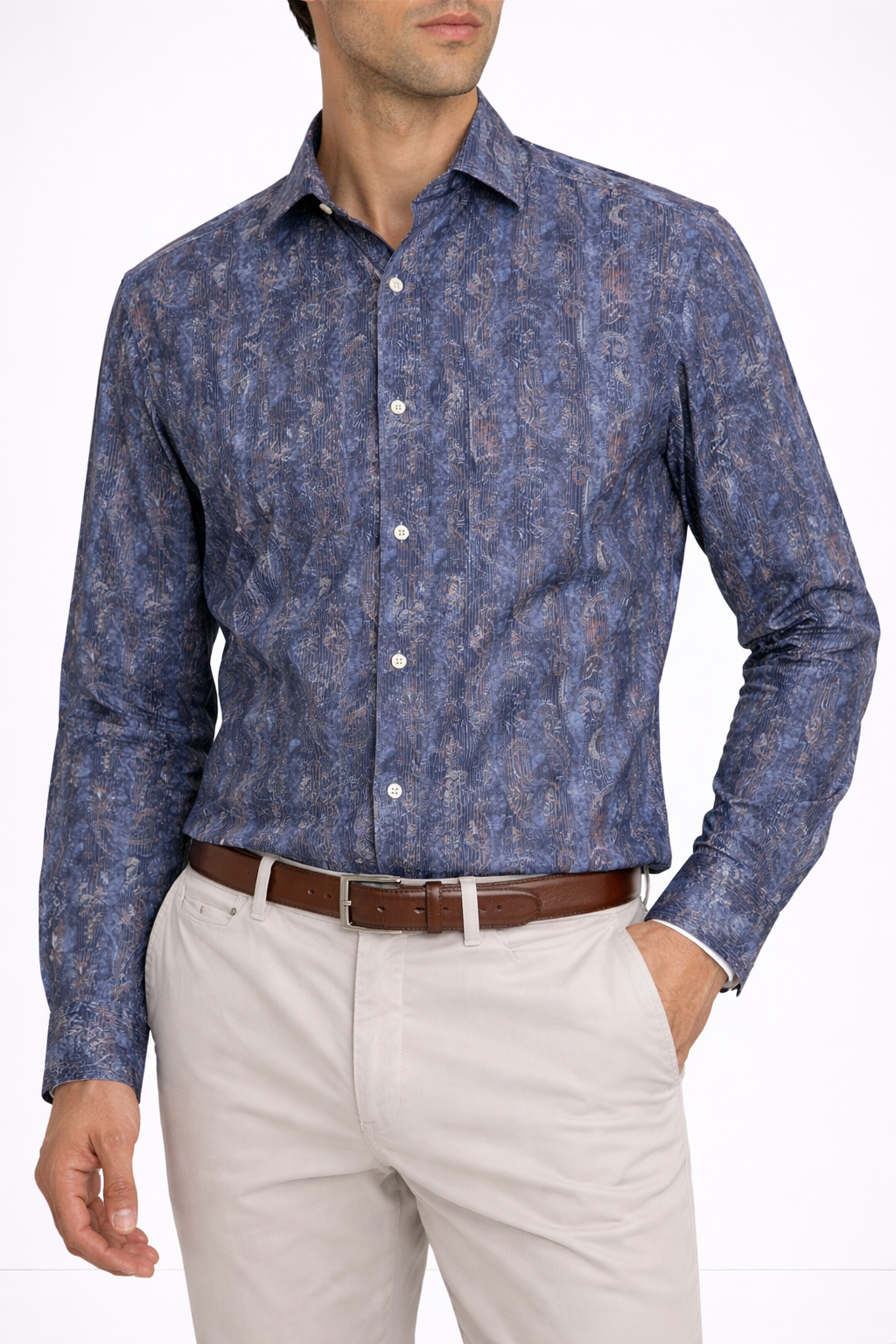 Man models a Luchiano Visconti Visconti Paisley Print Sport Shirt (BILELE54) with modern tailored fit, beige pants, and a brown belt, posing with one hand in his pocket against a plain background.
