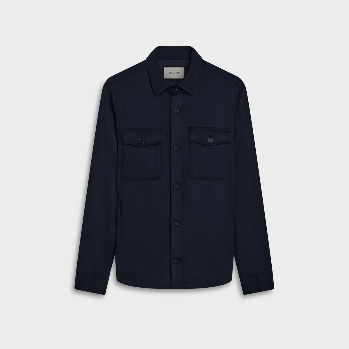 The Bugatchi Button Shirt Jacket KX9015JS1 by Bugatchi is a long-sleeve, dark navy OoohCotton shirt featuring 8-way stretch and two front chest pockets, displayed on a plain white background.