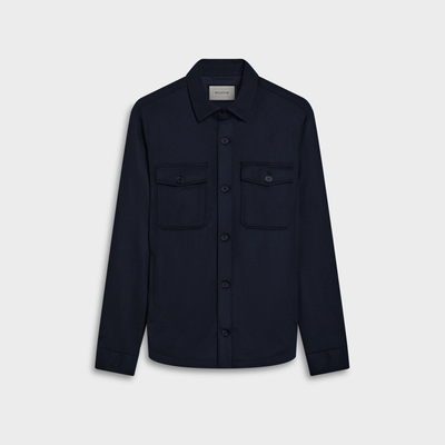 The Bugatchi Button Shirt Jacket KX9015JS1 by Bugatchi is a long-sleeve, dark navy OoohCotton shirt featuring 8-way stretch and two front chest pockets, displayed on a plain white background.