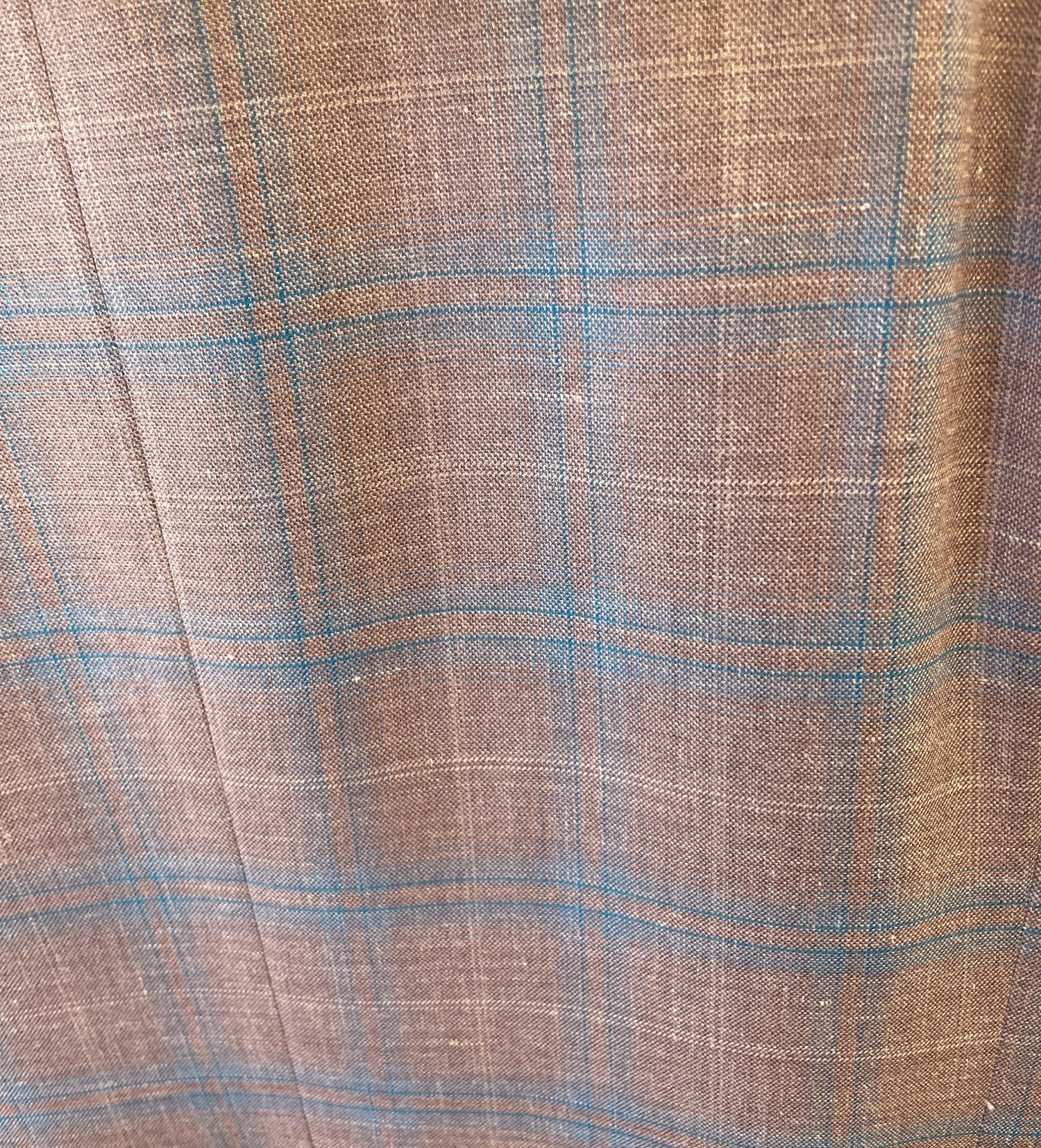 The Byron Contemporary Sport Coat 6674A features brown fabric with a blue and beige plaid, crafted from premium Italian material. Visible texture and woven threads give this Byron coat a modern fit with timeless appeal.