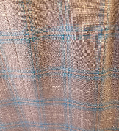 The Byron Contemporary Sport Coat 6674A features brown fabric with a blue and beige plaid, crafted from premium Italian material. Visible texture and woven threads give this Byron coat a modern fit with timeless appeal.