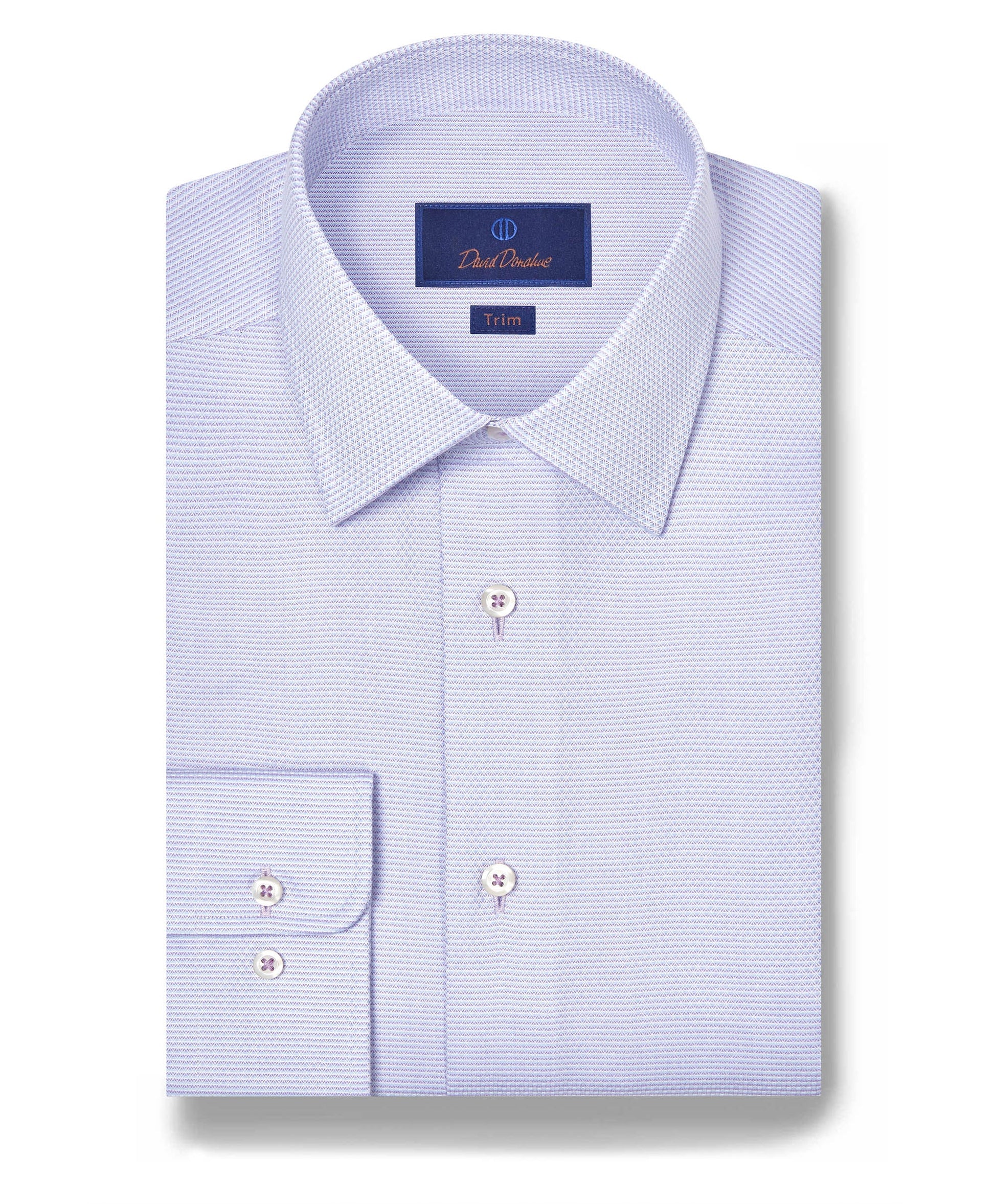 A folded lilac David Donahue OP Micro Dobby Dress Shirt with a pointed collar, white buttons, and a label displaying the brand and Trim fit.