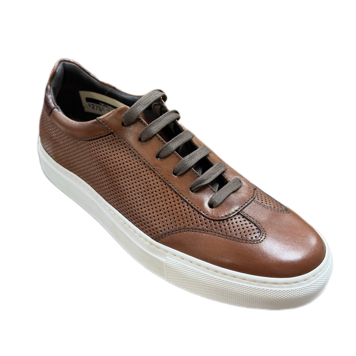 The Johnston Murphy Jake Sneaker features brown leather with perforated sides, dark brown laces, and a white rubber sole—a timeless premium sneaker for any occasion. Shown on a white background.