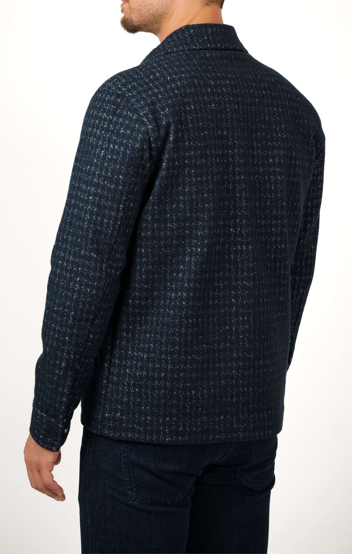 A person from the back wearing a dark navy Stone Rose Hunter Knit Houndstooth Jacket.
