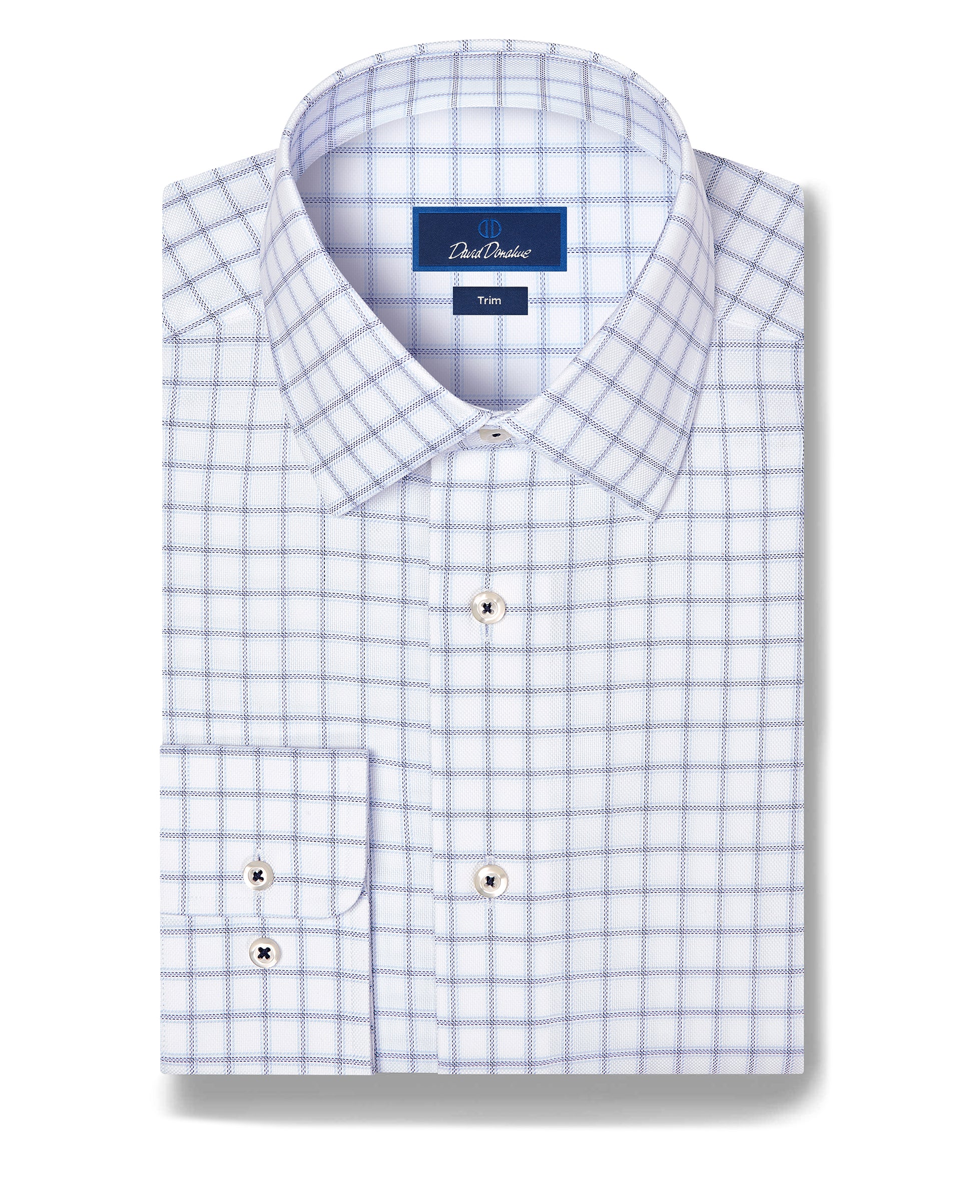 Folded long-sleeve men’s dress shirt featuring a white base with a blue windowpane check pattern, buttoned cuffs, and a label reading David Donahue. This classic David Donahue Windowpane Check Dress Shirt (TBSP13810) is crafted from Pima cotton for enhanced softness and durability.