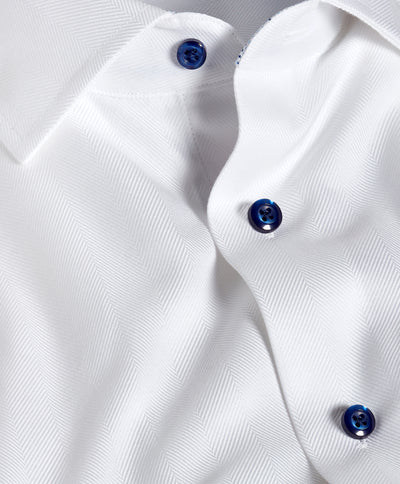Close-up of the David Donahue Contrast Herringbone Solid Dress Shirt TBMS13100 in white with blue buttons, made from Pima cotton and tailored for a trim fit.