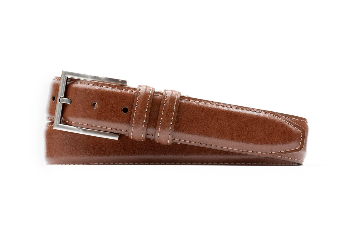 The Martin Dingman Samuel Coachman Leather Belt features Italian burnished kipskin, white stitching, and a silver buckle for classic style.
