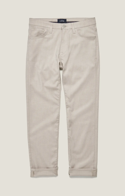 The 34 Heritage Courage Cross Twill pants by 34 Heritage are light beige, straight-leg trousers crafted from breathable twill fabric, featuring rolled cuffs, front and back pockets, and a button-zip closure, shown laid flat on a neutral background.