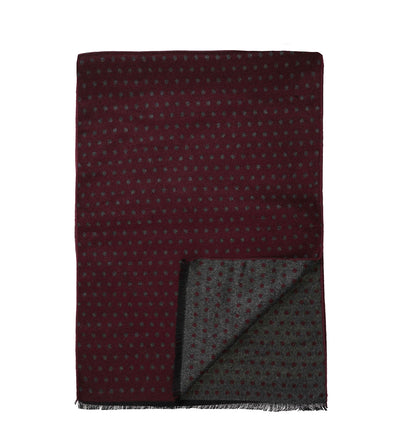 The Amanda Christensen Double Face Dot Scarf 440614 is a rectangular maroon scarf with small gray dots and a reversible design featuring a similar motif on both sides.