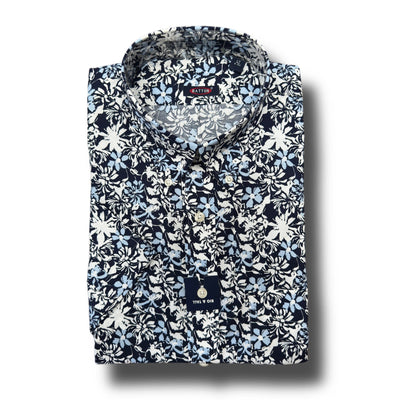 A folded Batton Ryland Big & Tall Sport Shirt, 100% cotton with a blue and white floral pattern, long sleeves, button-up design, and visible Batton brand tag. Ideal for those seeking stylish Big & Tall shirts.