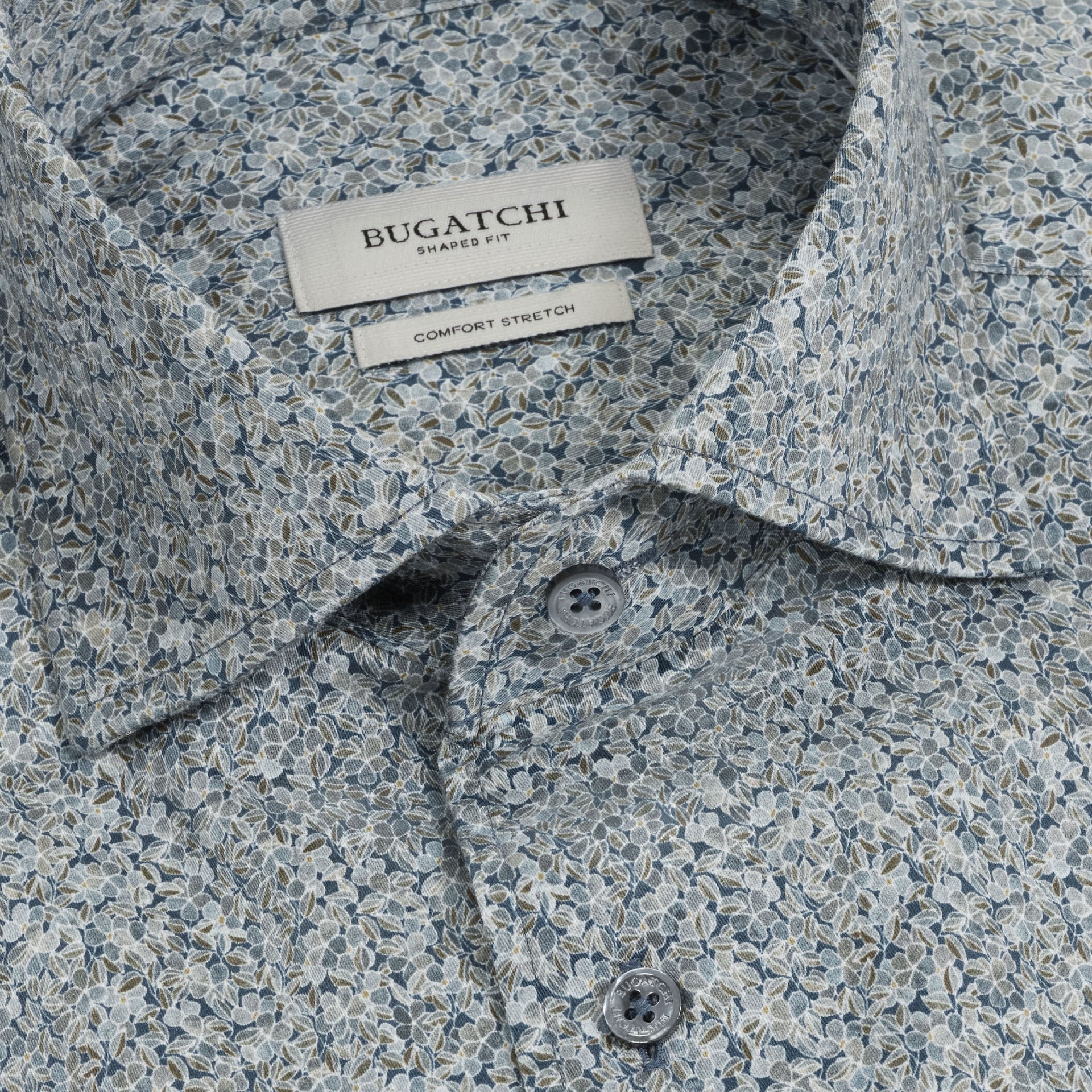 Close-up of the Bugatchi Alvin Floral Sport Shirt (KS3128L80S) for men, featuring a blue and gray leaf pattern with a Shaped Fit and Comfort Stretch. This wrinkle-resistant shirt combines Bugatchi’s sophisticated style with everyday comfort.