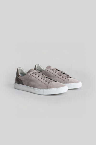 A pair of light gray Robert Barakett Huberto Suede Sneakers with white rubber soles, from Robert Barakett, displayed on a plain gray background.
