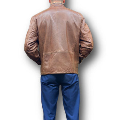 A person photographed from the back against a white background wears the Missani Leather Jacket 392834 by Missani with blue pants.