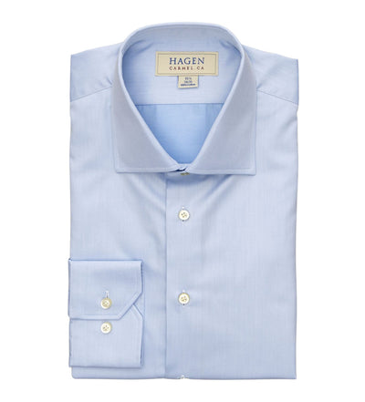A neatly folded Hagen Solid Twill Shirt MB1864400 in light blue, crafted from superfine 100% cotton twill with white buttons and featuring a Hagen label on the inside collar.