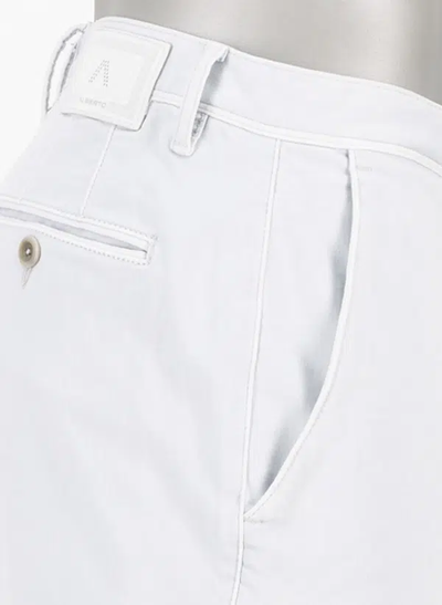 Close-up of the hip area of Alberto Pipe 1582 Color Denim Big & Tall trousers by Alberto, highlighting a side pocket, belt loop, and part of a buttoned back pocket.
