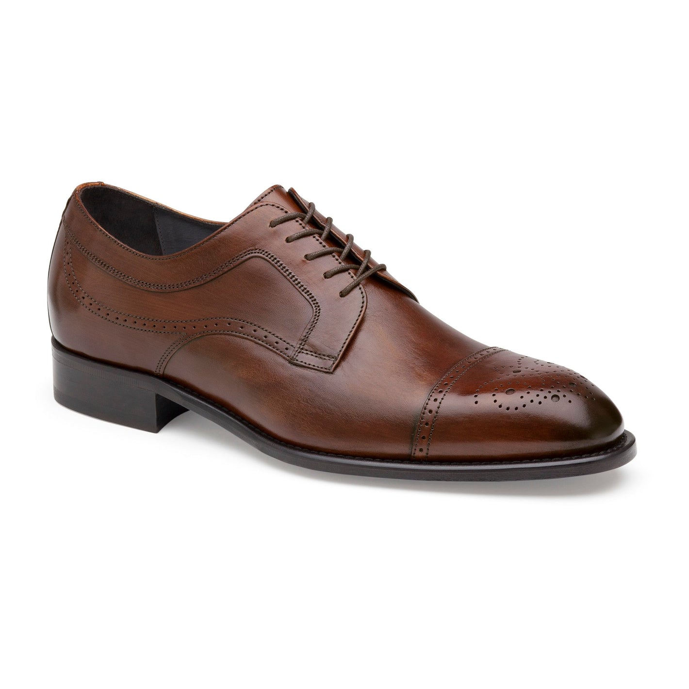 The Johnston & Murphy Ellsworth Cap Toe is a brown Italian calfskin men’s dress shoe with laces, brogue detailing on the toe cap, stitch accents along the sides, and a durable leather outsole.
