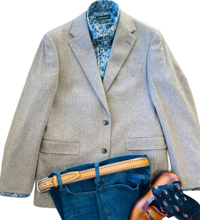 The Giles & Jasper Cashmere Coat Big&Tall is styled with a blue patterned shirt, blue jeans, tan belt, brown dress shoes, and patterned socks—all laid out flat for a refined look.