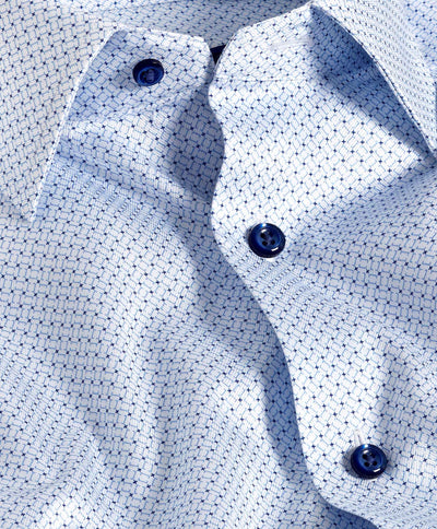 Close-up of the David Donahue Geometric Prt Shirt TBSP11205 in light blue, featuring a geometric print, dark blue buttons, and a slightly wrinkled texture.