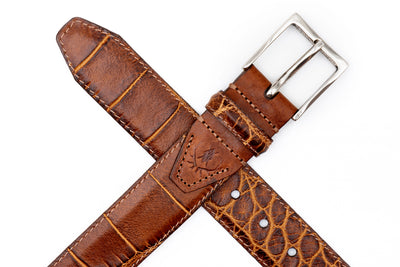 Martin Dingman Perry Alligator Grain Belt with textured pattern and silver buckle, displayed in a cross shape on a white background.
