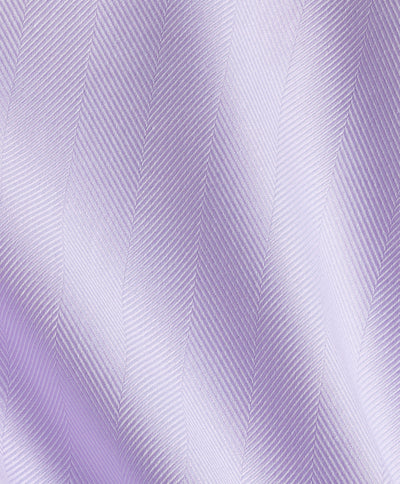 Close-up of the David Donahue Contrast Herringbone Solid Dress Shirt TBMS13100 fabric in light purple, featuring a subtle diagonal ripple and soft, lustrous texture.