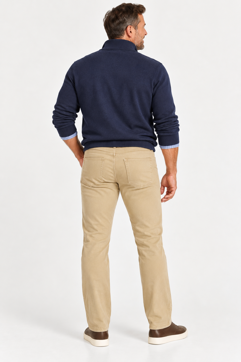 Man with his back to the camera in a navy sweater, light blue shirt, and beige Alberto PIPE 1607 Diamond Brushed Stretch Cotton Jeans by Alberto, on a white background.