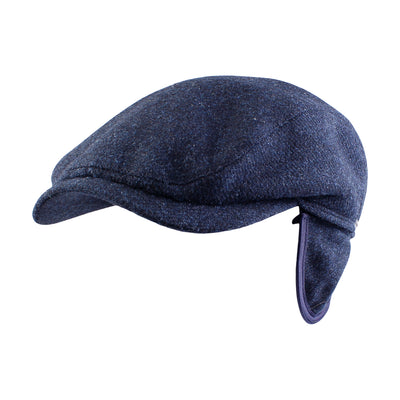 The Wigens Ivy Contempo Cap 110553 is a blue Melton wool Ivy cap with a curved brim and hidden earflaps folded underneath.