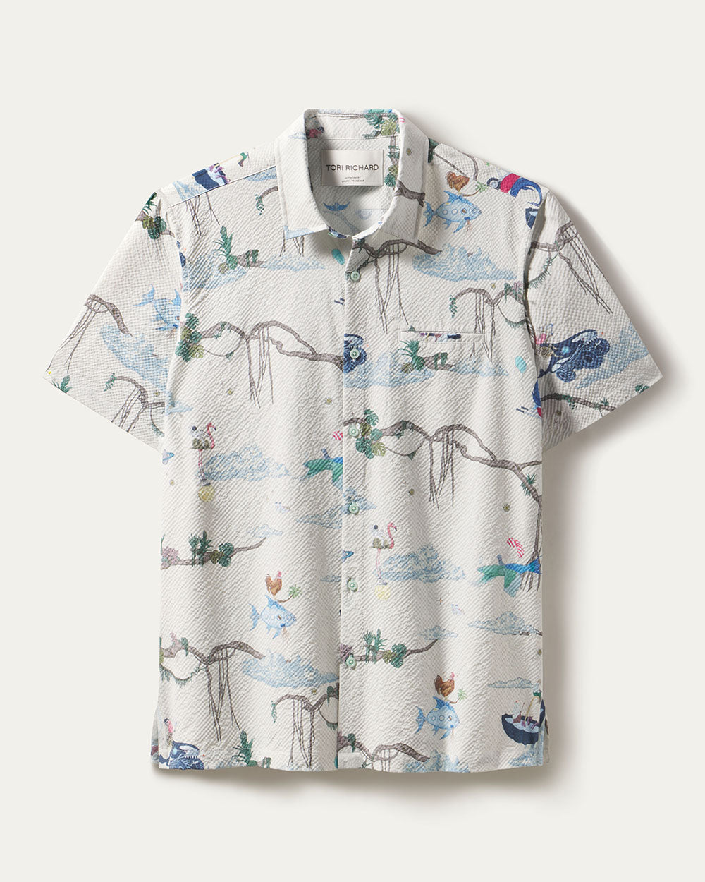 Introducing the Tori Richard Print Curious Sky Shirt (T0197M0419) by Tori Richard—a short-sleeve button-up shirt featuring a crisp white base adorned with a vibrant print inspired by Hawaiian birds, trees, and water. Expertly crafted in Hawaii from soft cotton lawn, this shirt provides a breezy and comfortable fit perfect for any casual occasion.