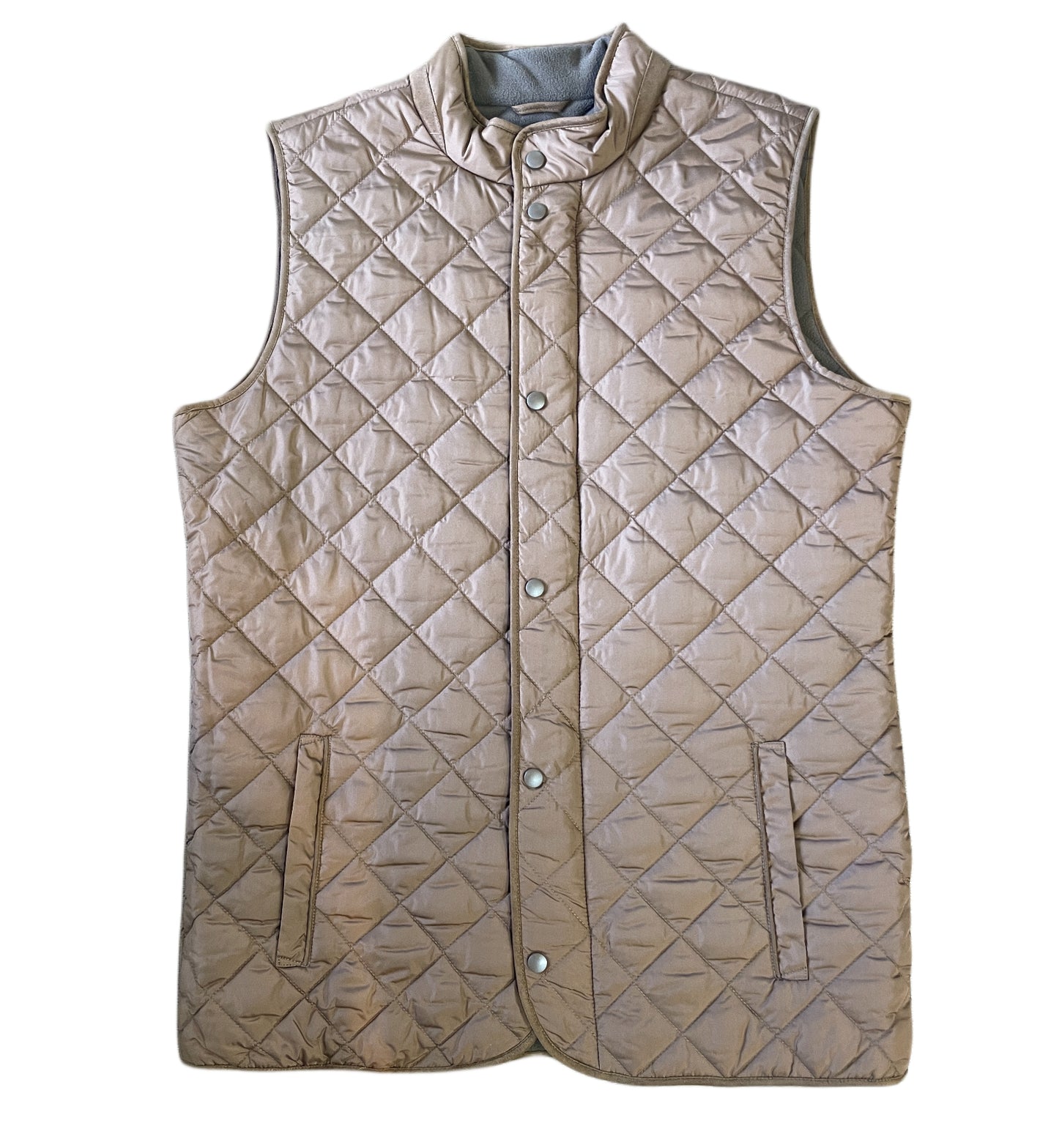 A beige F/X Fusion Quilted Field Vest by F/X Fusion, sleeveless with snap buttons and two front pockets, is displayed flat on a white background—a timeless men's outerwear piece.