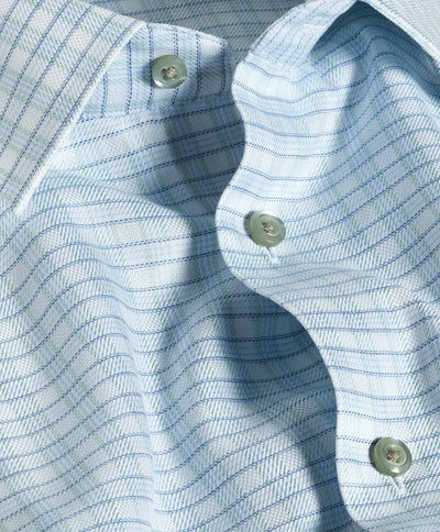 Close-up of the David Donahue Pistachio Dobby Check Shirt TBSP12805129, featuring a light blue and white plaid pattern with green buttons, highlighting the fabric texture and folds.