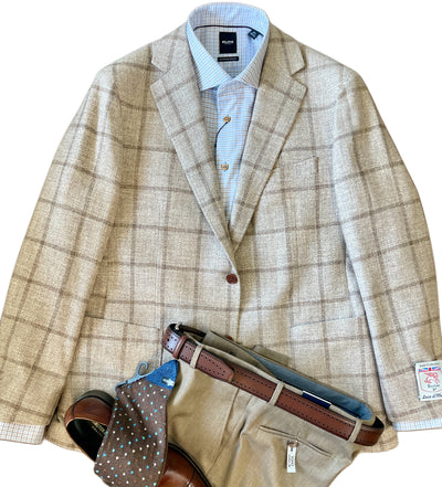 Beige plaid blazer over a light blue checkered shirt, tan dress pants, brown belt and shoes, finished with a polka dot tie inspired by the Byron Luca Sport Coat Windowpane 9526 from Byron for a polished look.
