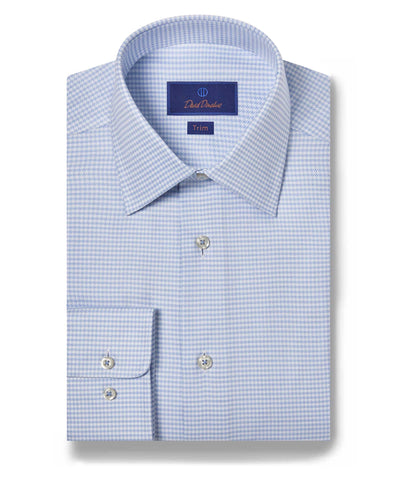 A neatly folded David Donahue Twill Check TBSP10800 dress shirt in light blue and white houndstooth, featuring a spread collar, barrel cuffs, US Pima cotton fabric, and a "Trim" fit label inside the collar.