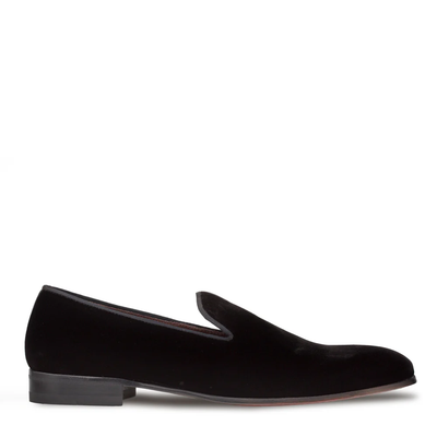 The Mezlan Lublin Velvet Loafer by Mezlan is a black slip-on with a low heel and almond toe, shown in profile against a white background.