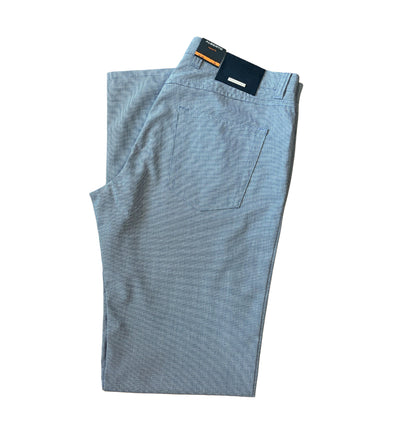 A pair of lightweight Alberto Ceramica Pipe 1351 pants in light blue, folded neatly with a visible back pocket and a dark blue waistband label.